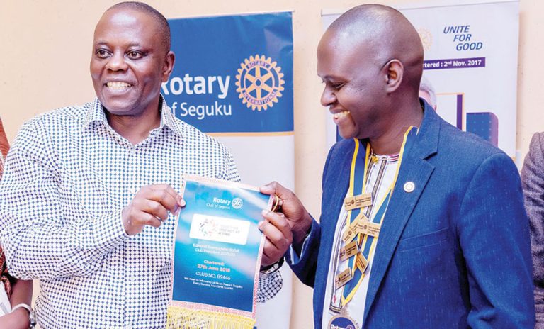 202509Dr-Anthony-Wamala-L-receives-a-gift-from-Edmond-Safali