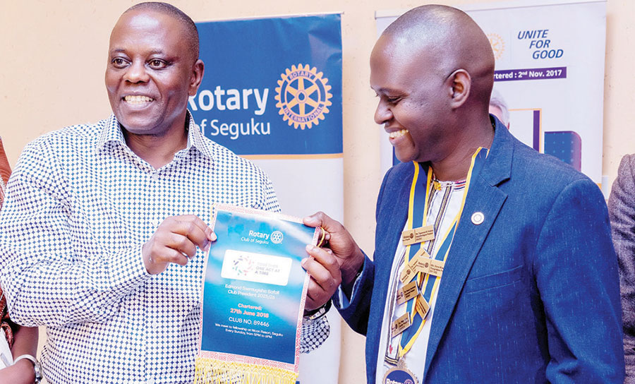 202509Dr-Anthony-Wamala-L-receives-a-gift-from-Edmond-Safali