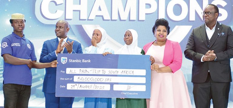 202509Minister-Balaam-and-Mumba-Kenneth-Kalifungwa-hand-over-a-dummy-cheque