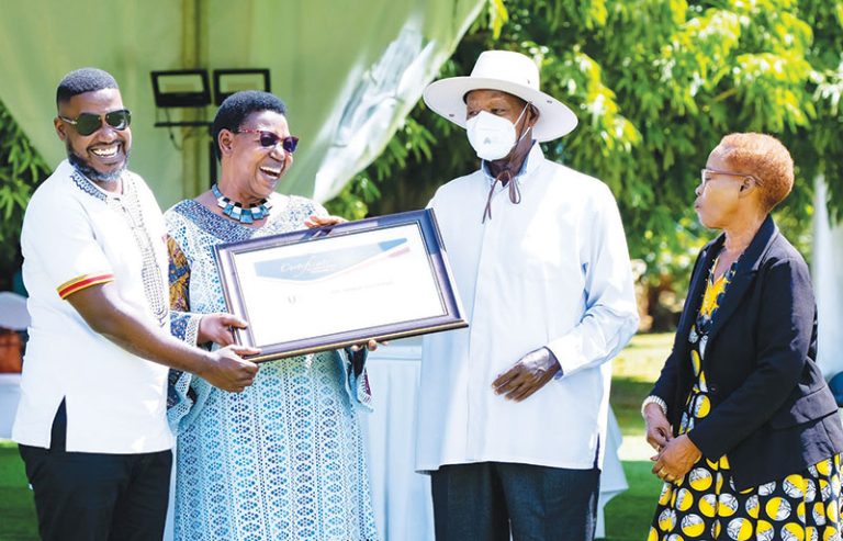 202509Museveni-hands-an-award-to-Miria-Matembe