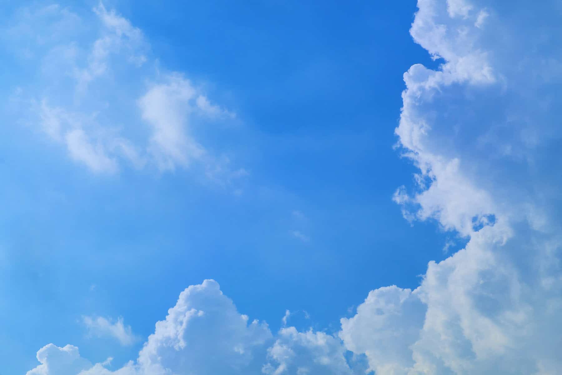 High up angle view of blue sky and partly cloudy in daylight on summer season