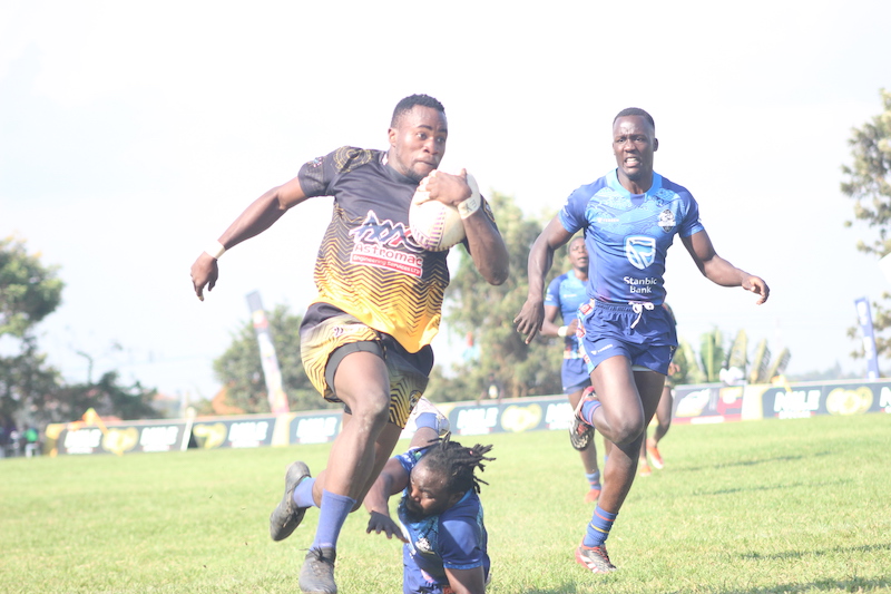 202509Walukuba-Barbarians-Ivan-Bulima-leaves-the-Black-Pirates-star-Conrad-Wanyama-in-a-pile-while-Jones-Kamiza-grimaces-in-resignation-of-a-chase