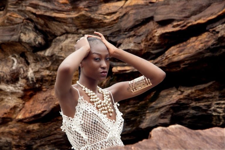 202509Woman-by-the-rocks
