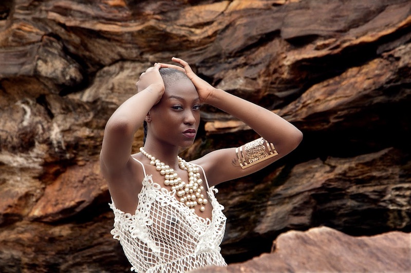 202509Woman-by-the-rocks