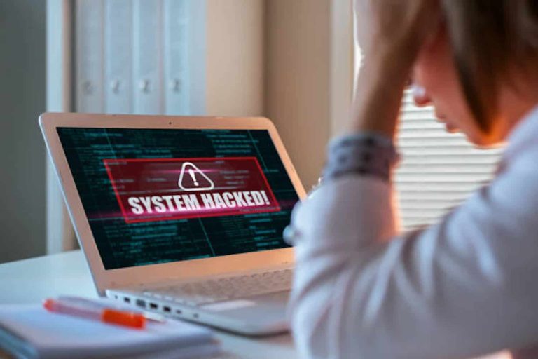 Worried woman looking at laptop. Internet fraud concept.