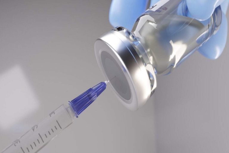 Syringe and vaccine vial.
