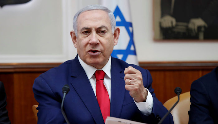 FILE PHOTO: Israeli Prime Minister Benjamin Netanyahu gestures during a weekly cabinet meeting in Jerusalem