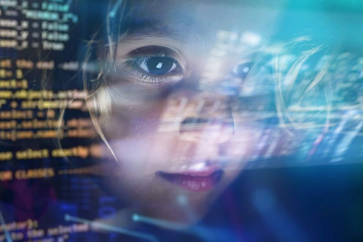 Close up of a little girl looking at some futuristic holograms.