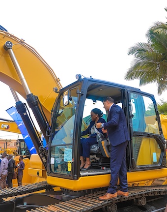 202510Kate-Kiiza-and-Mohammed-Ibrahim-on-a-grader