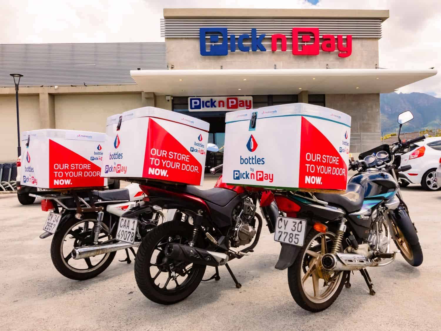 Express Service home delivery bikes parked outside local Pick n Pay grocery store