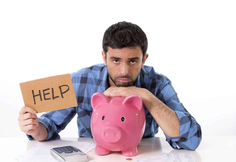 sad man in stress with piggy bank bad financial situation
