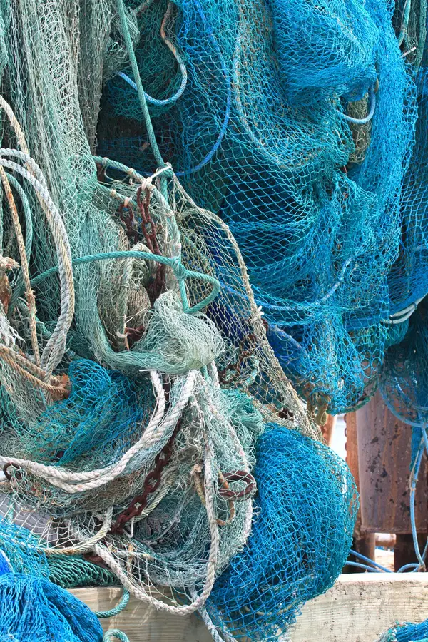 commercial-fishing-net-hanging-out-to-dry-23192524