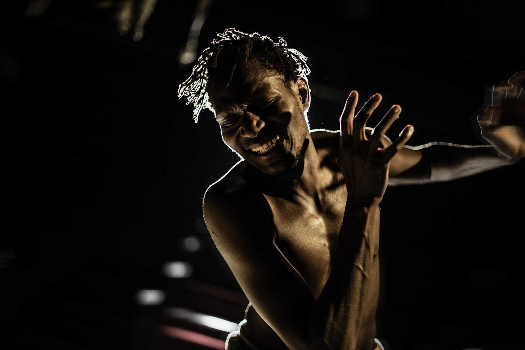 202510John-Rwothomack-on-stage-in-Far-Gone-2