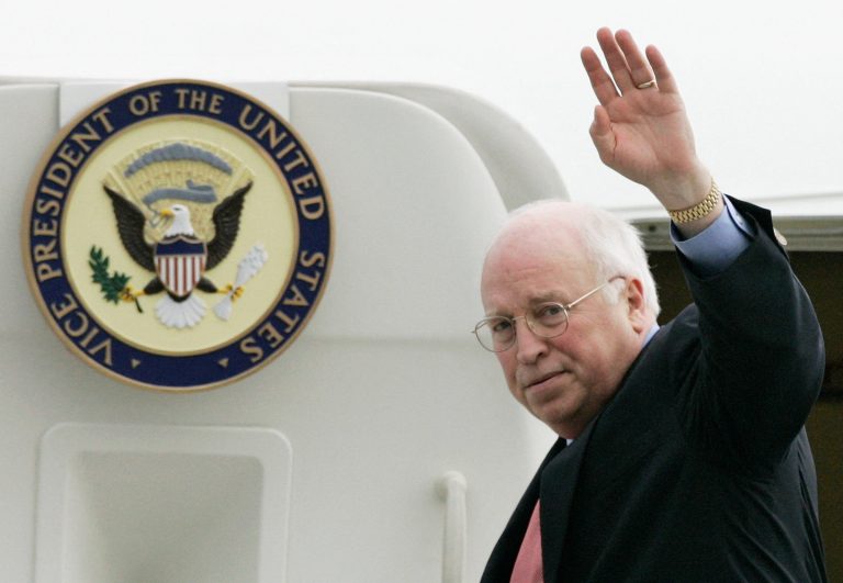 FILE PHOTO: United States Vice President Cheney waves farewell to officials as he boards his Boeing 757 jet before take off at Sydney Airport