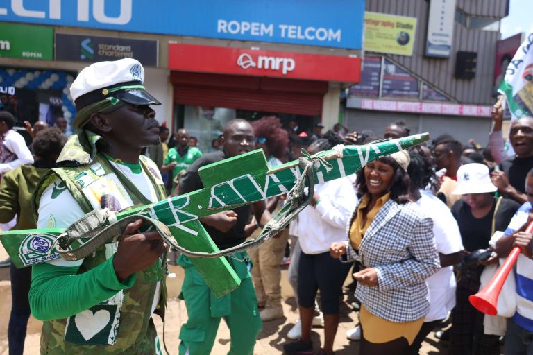 A Gor Mahia fan is pictured near the Kenya National Archives in