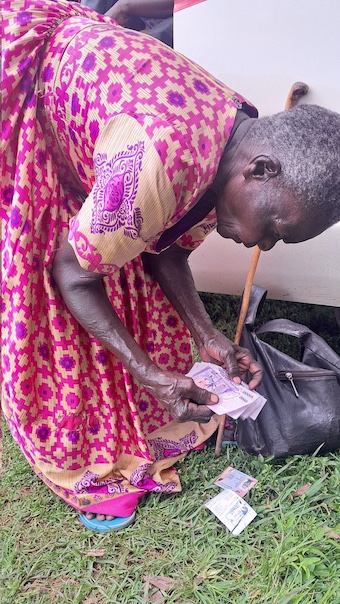 202511Elderly-woman-after-receiving-SAGE-cash
