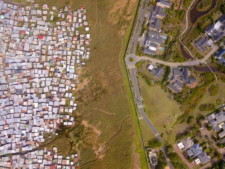 Aerial view of township and wealthy houses, in divided South Africa