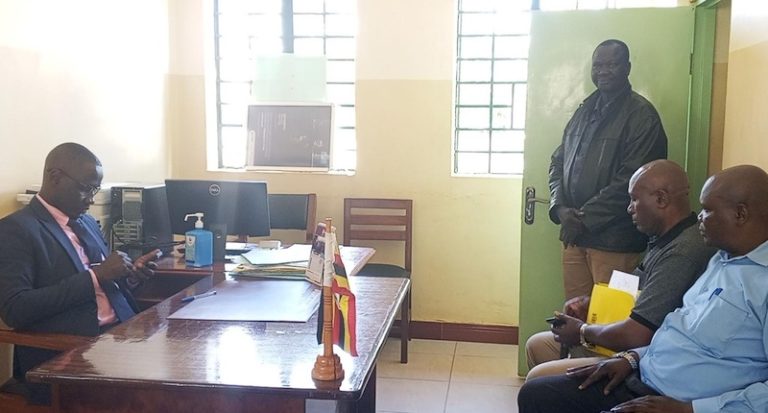 202511Peter-Abola-in-black-jacket-appears-before-the-Omoro-Grade-One-Magistrate-Bonny-Akol-in-Gulu-City