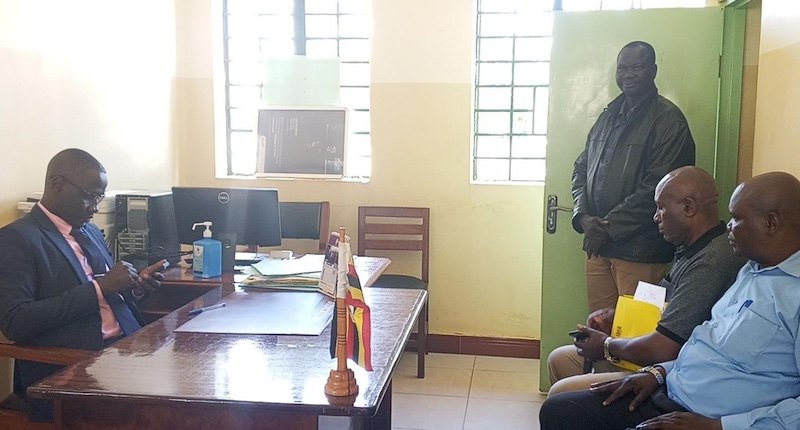 202511Peter-Abola-in-black-jacket-appears-before-the-Omoro-Grade-One-Magistrate-Bonny-Akol-in-Gulu-City