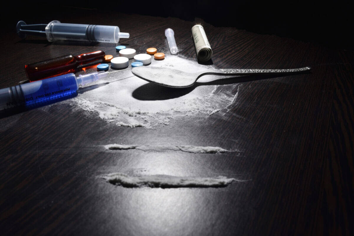 drugs concept , cocaine,injection,table,spoon on dark table
