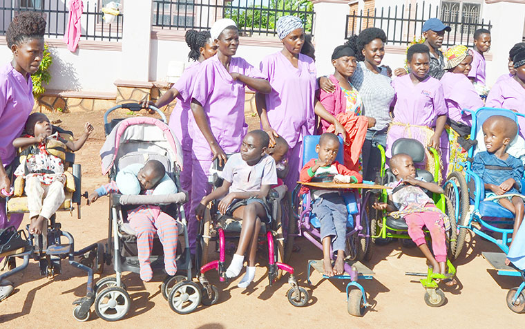 202212Disabled-children-and-caretakers-at-Home-of-Hope-facility