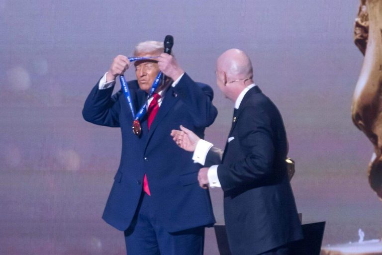 U.S. President Donald Trump receives the FIFA Peace Prize from FIFA President Gianni Infantino at the FIFA World Cup 2026 Official Draw at the John F. Kennedy Center for the Performing Arts