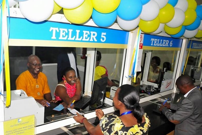 202512Post-Bank-Uganda-MD-Stephen-Mukweli-L-serving-customers