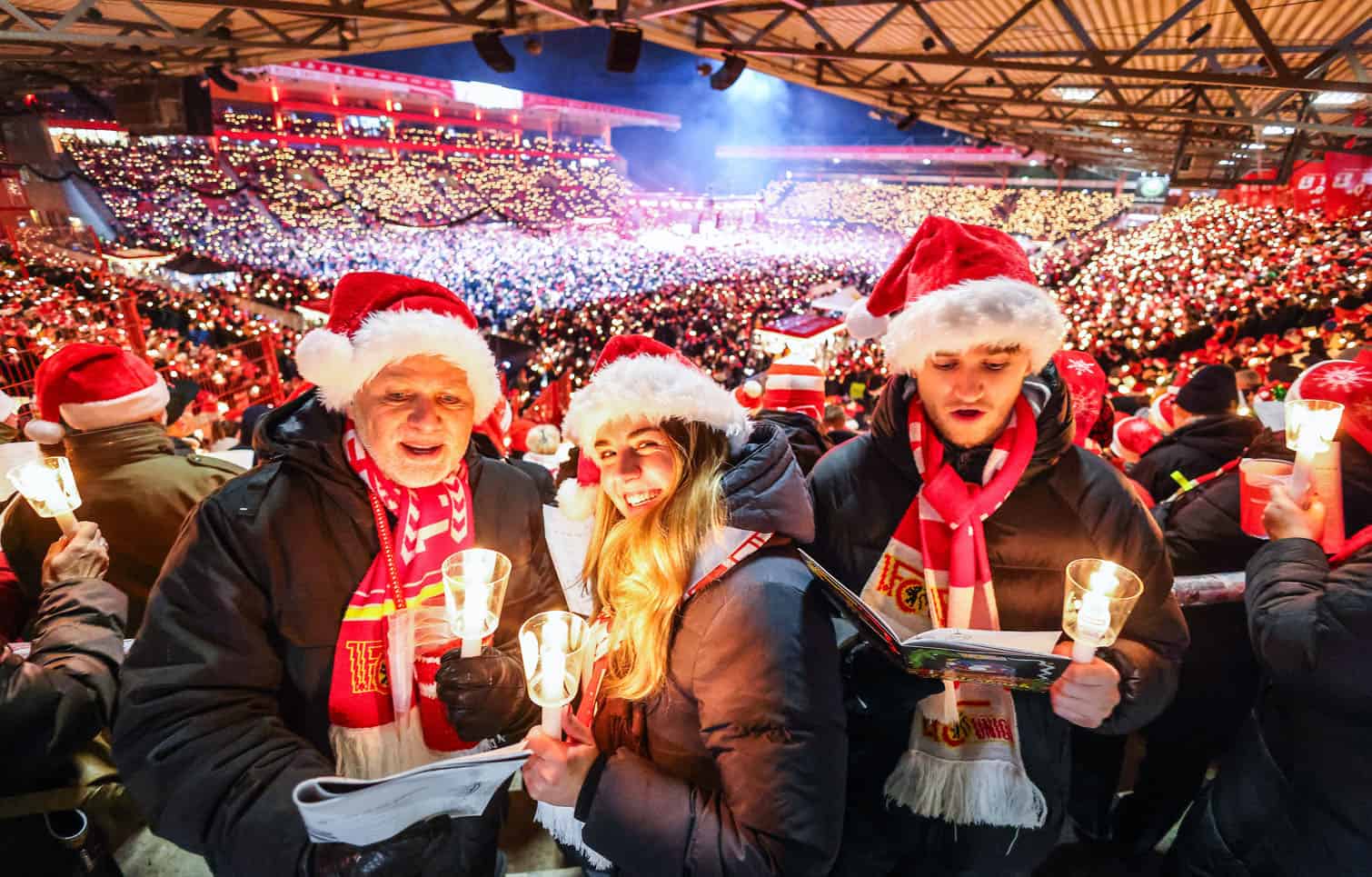 Fans sing traditional christmas carols at 1. FC Union Berlin football club stadium