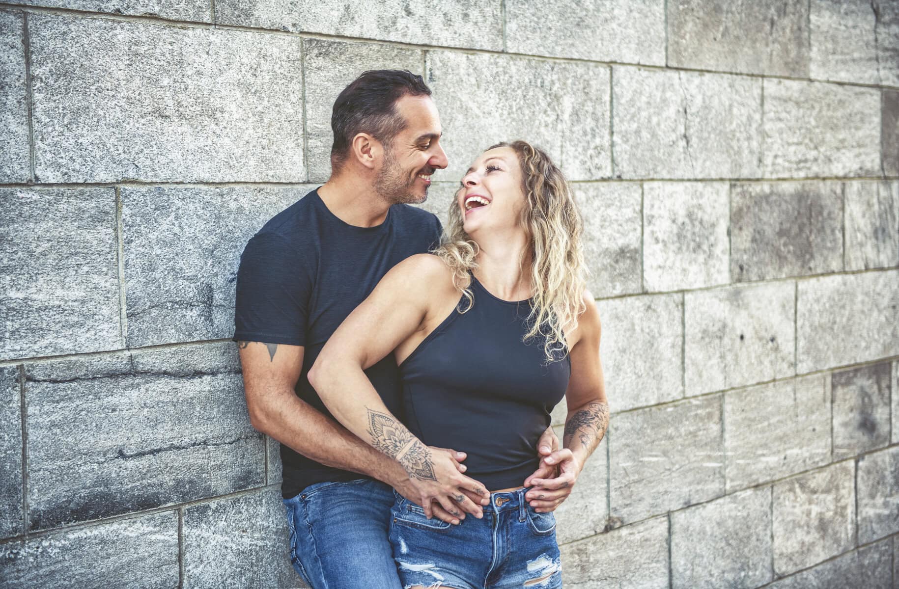 Beautiful couple having fun outdoors on urban background