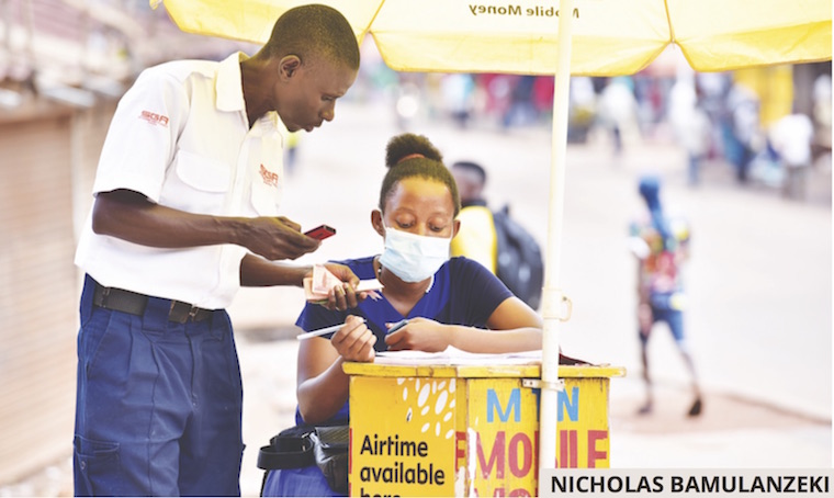 202006Security-officer-makes-mobille-money-transaction