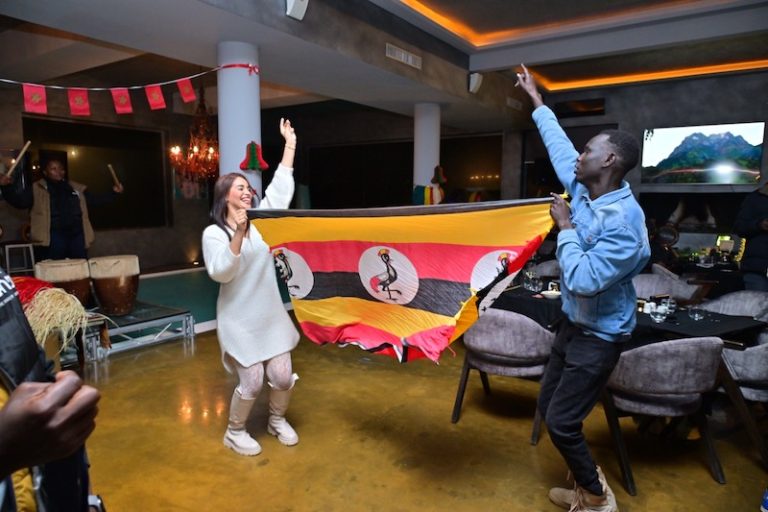 202601Ugandans-with-the-flag-in-Morocco