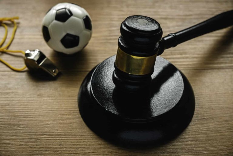 Law and soccer sport.Football coach accused. Concussion lawsuit.