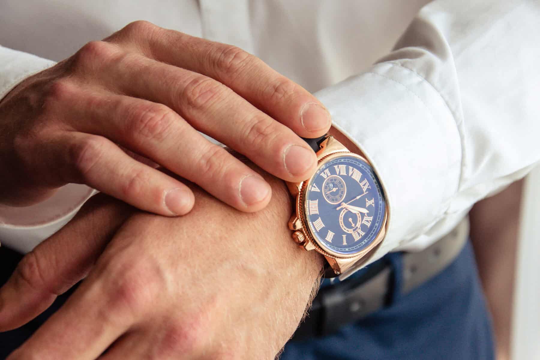 A man checking a wristwatch closeup