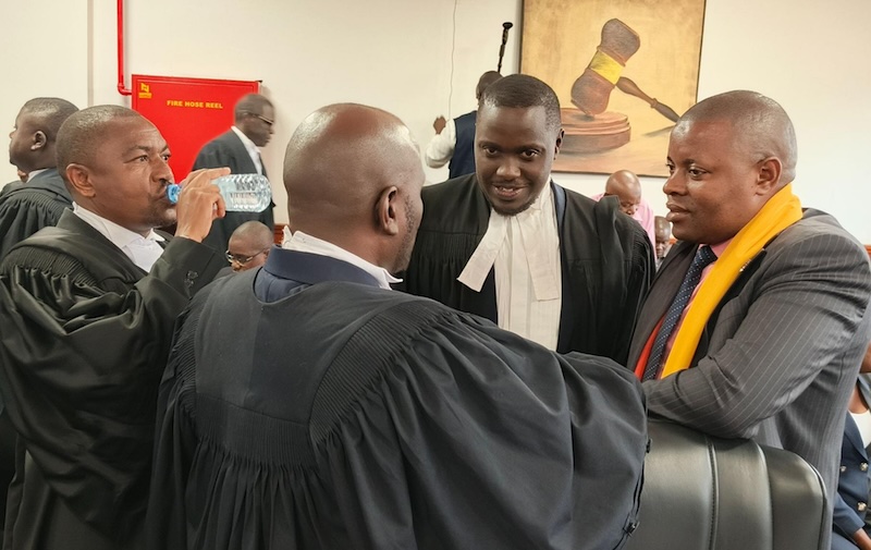 202602Presidential-election-petitioner-Moses-Kasibante-with-his-lawyers-in-court