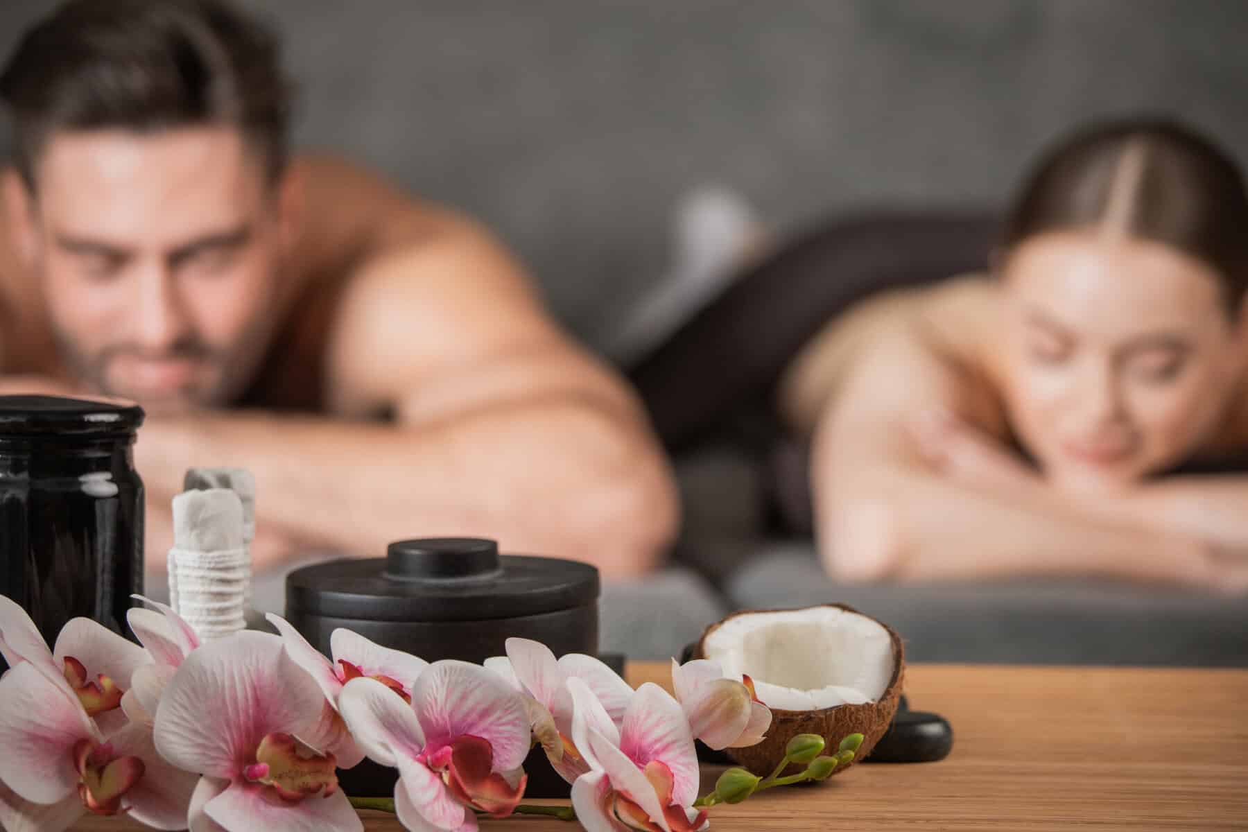 Couple lying in spa salon