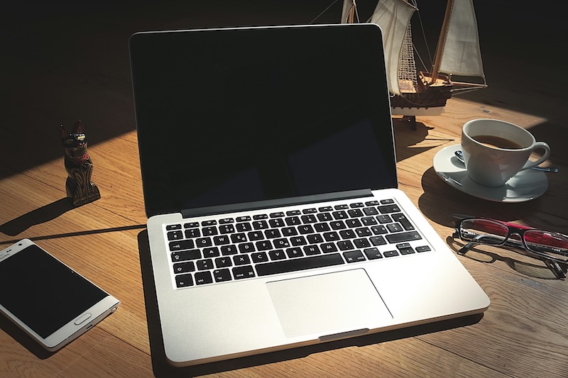 202603Apple-laptop-on-desk