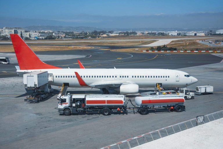 Truck with a tank and a trailer of aviation fuel during the refueling of the aircraft and its service before the flight.