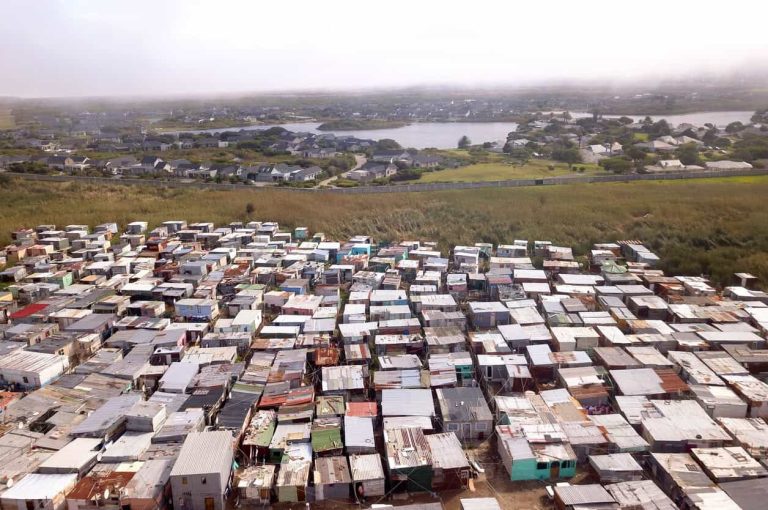 Aerial view of township and wealthy houses, in divided South Africa