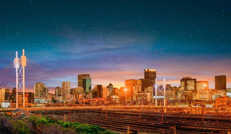 Nelson Mandela Bridge at night with Johannesburg city skyline