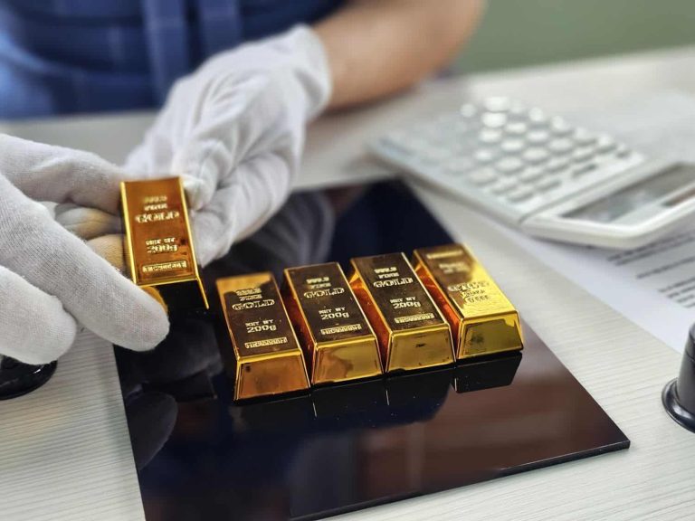 Gold bars being weighed and assessed at a financial facility during business