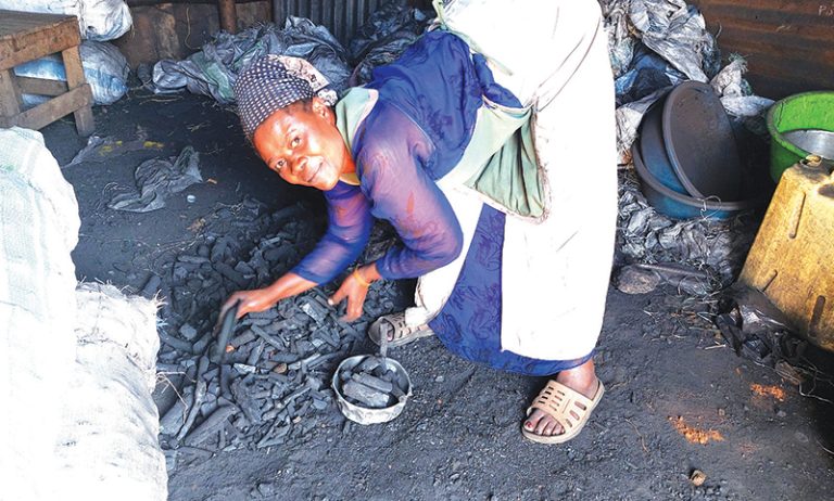 202603Woman-selling-charcoal
