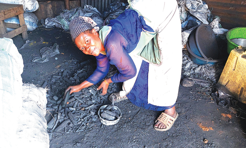 202603Woman-selling-charcoal