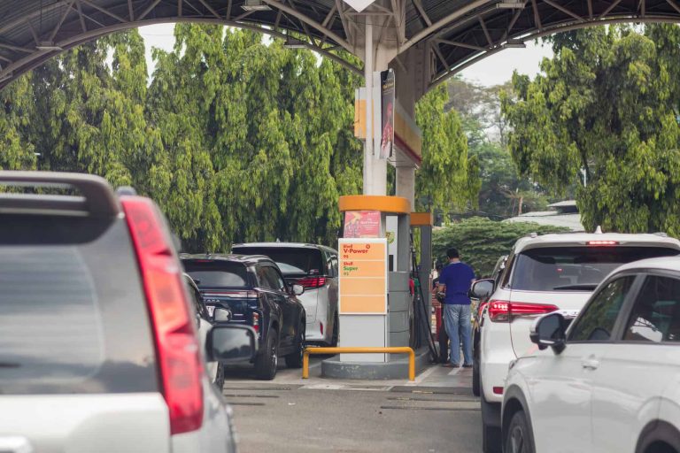 Queuing cars waiting to buy fuel at a Shell petrol filling station in South Jakarta