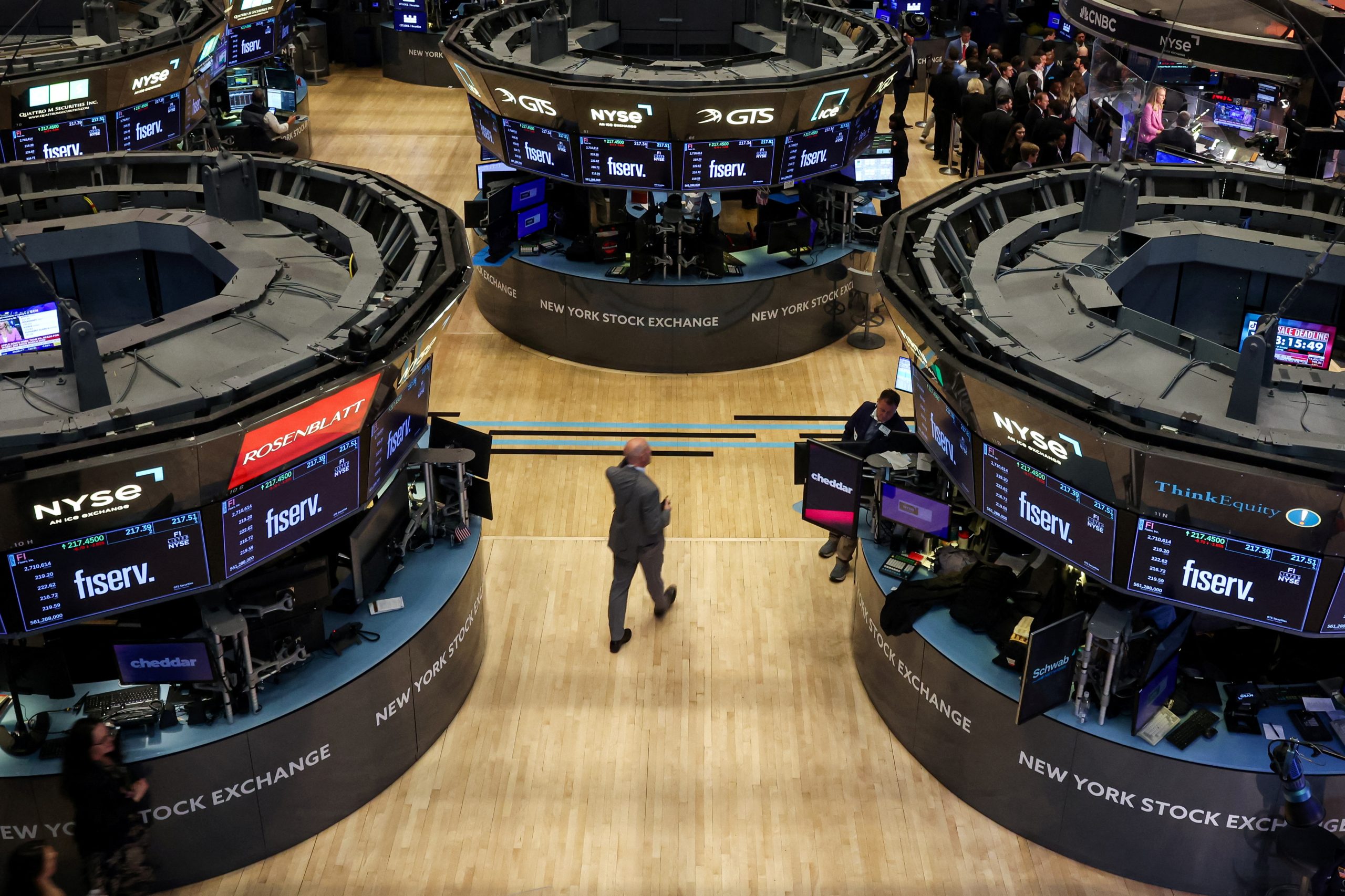 Traders work on the floor of the NYSE in New York