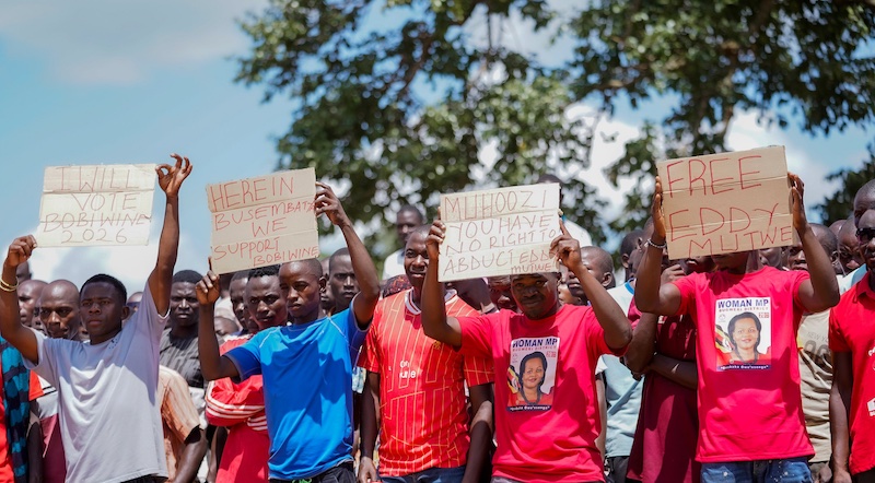 202505Youth-hold-a-placard-protest
