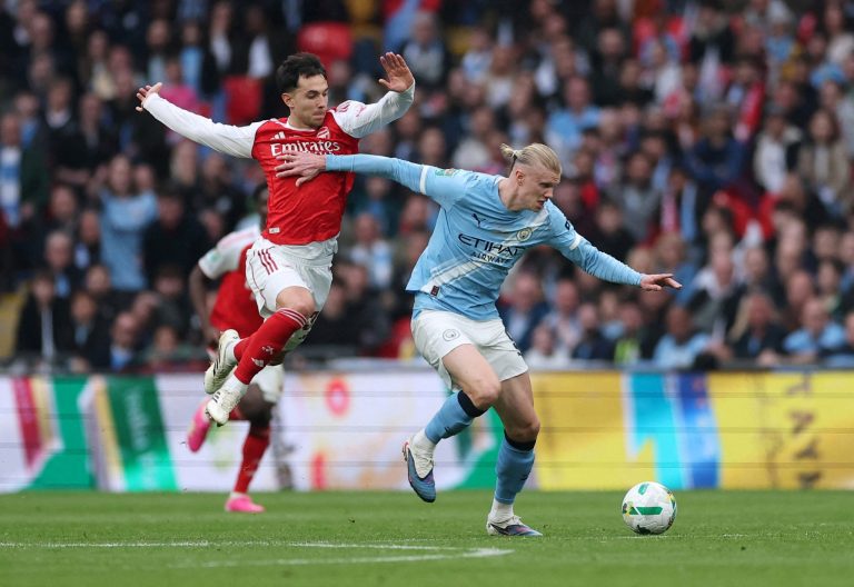 2026042026-03-22T180412Z_432381890_UP1EM3M1BYRPE_RTRMADP_3_SOCCER-ENGLAND-ARS-MCI-scaled-1