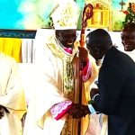 202604Bishop-Mukasa-shakes-hands-with-Denis-Ssekabira