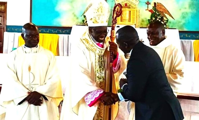 202604Bishop-Mukasa-shakes-hands-with-Denis-Ssekabira