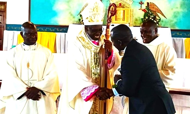 202604Bishop-Mukasa-shakes-hands-with-Denis-Ssekabira