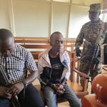 202604Christopher-Okello-Onyum-guarded-by-security